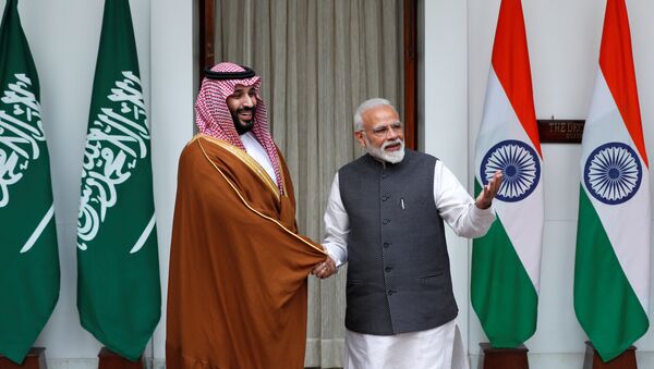 Saudi Arabia's Crown Prince Mohammed bin Salman shakes hands with India's Prime Minister Narendra Modi ahead of their meeting at Hyderabad House in New Delhi, India, February 20, 2019 - Sputnik International