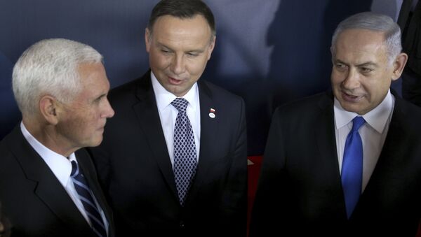 From left, United States Vice President Mike Pence, Poland's President Andrzej Duda and Israeli Prime Minister Benjamin Netanyahu talk after a group photo at the Royal Castle in Warsaw, Poland, Wednesday, Feb. 13, 2019 - Sputnik International
