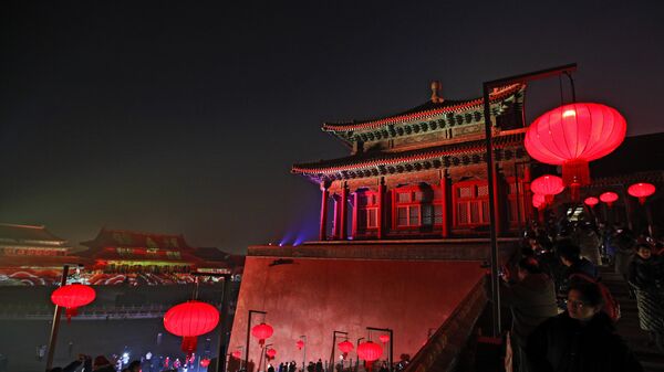 Visitors tour the Forbidden City decorated with red lanterns and illuminated with lights during the Lantern Festival in Beijing, Tuesday, Feb. 19, 2019.  - Sputnik International