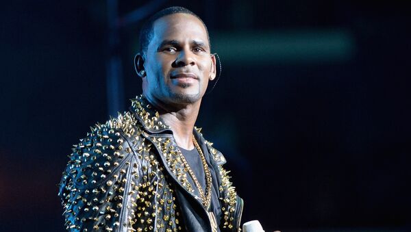 In this file photo taken on June 29, 2013, R. Kelly performs onstage during R. Kelly, New Edition and The Jacksons at the 2013 BET Experience at Staples Center in Los Angeles, California. R&B star R. Kelly has been charged with 10 counts of aggravated criminal sex abuse, at least some involving minors, a Cook County court official said Friday, February 22, 2019. - Sputnik International