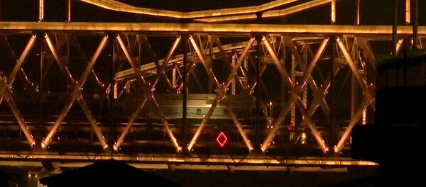 In this image taken from video footage, a train similar to ones seen during previous visits to China by North Korean leader Kim Jong Un crosses the Friendship Bridge from North Korea into China as seen from Dandong in northeastern China's Liaoning Province, Saturday, Feb. 23, 2019. A train similar to one used in the past by Kim Jong Un entered China on Saturday evening, possibly carrying the North Korean leader on a journey to Vietnam's capital for his summit with President Donald Trump In this image taken from video footage, a train similar to ones seen during previous visits to China by North Korean leader Kim Jong Un crosses the Friendship Bridge from North Korea into China as seen from Dandong in northeastern China's Liaoning Province, Saturday, Feb. 23, 2019. A train similar to one used in the past by Kim Jong Un entered China on Saturday evening, possibly carrying the North Korean leader on a journey to Vietnam's capital for his summit with President Donald Trump - Sputnik International