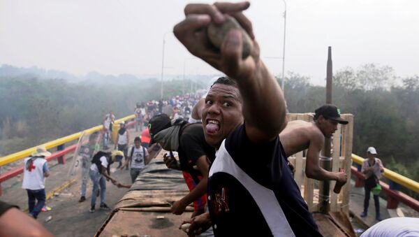Opposition supporters clash with Venezuela's security forces at Francisco de Paula Santander bridge on the border line between Colombia and Venezuela as seen from Cucuta, Colombia, February 23, 2019 - Sputnik International