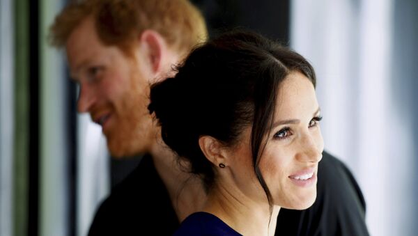 Britain's Prince Harry and Meghan, Duchess of Sussex smile during their visit to the National Kiwi Hatchery at Rainbow Springs in Rotorua, New Zealand, Wednesday, Oct. 31, 2018 - Sputnik International