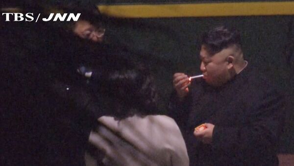In this image made from Japan’s TBS TV video on early Tuesday, Feb. 26, 2019, North Korean leader Kim Jong Un, a habitual smoker, takes a pre-dawn smoke break at the train station in Nanning, China, hours before his arrival in Vietnam for his high-stakes summit with President Donald Trump over resolving the international standoff over the North’s nuclear weapons and missiles - Sputnik International