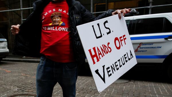 A man arrives to attend a protest against U.S. foreign policy on Venezuela outside the Trump Building in New York City, New York, U.S., February 23, 2019 - Sputnik International