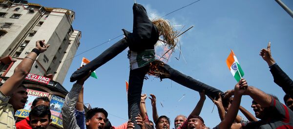 People burn an effigy depicting Pakistan as they celebrate after Indian authorities said their jets conducted airstrikes on militant camps in Pakistani territory, in Ahmedabad People burn an effigy depicting Pakistan as they celebrate after Indian authorities said their jets conducted airstrikes on militant camps in Pakistani territory, in Ahmedabad - Sputnik International