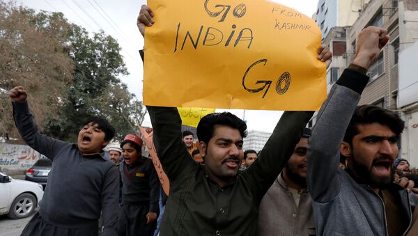 People carry a sign as they chant slogans against what they call airspace violation by the Indian military aircrafts, in a protest in Peshawar, Pakistan February 26, 2019 - Sputnik International