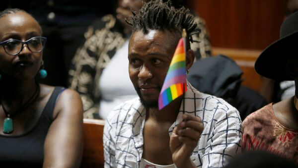 An LGBT activist holds the rainbow flag during a court hearing in the Milimani high Court in Nairobi in Nairobi, Kenya - Sputnik International