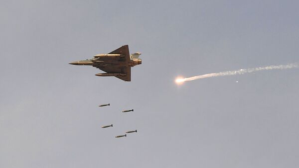 In this photo taken on February 16, 2019, an Indian Air Force (IAF) Mirage-2000 fighter aircraft drops bombs during the 'Vayu Shakti 2019' fire power demonstration at the IAF's firing range field in Pokhran in the state of Rajasthan - Sputnik International