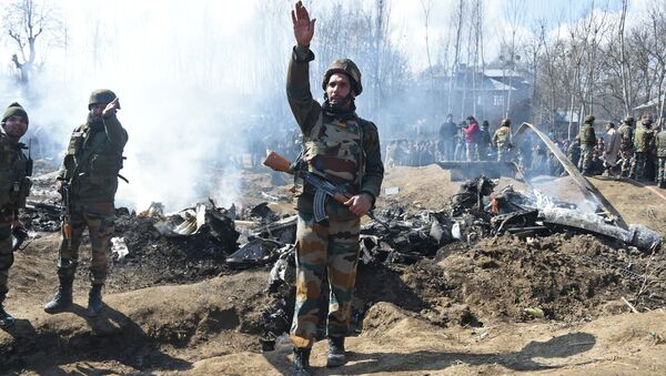 Indian soldiers gesture near the remains of an Indian Air Force aircraft after it crashed in Budgam district, some 30 kms from Srinagar on February 27, 2019 - Sputnik International