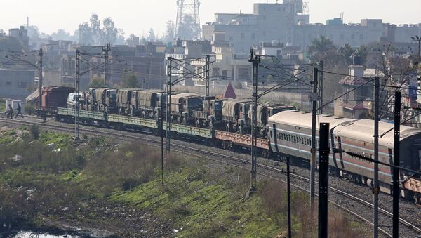 Indian army trucks are transported on a train near a railway station on the outskirts of Jammu February 28, 2019 - Sputnik International