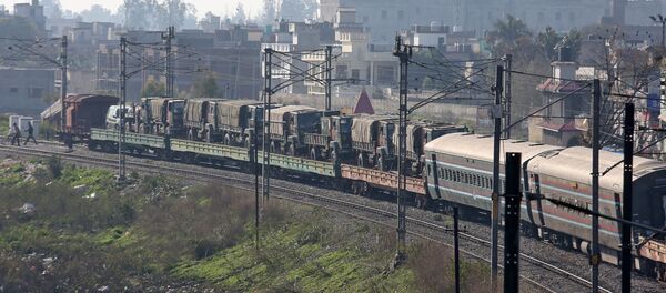 Indian army trucks are transported on a train near a railway station on the outskirts of Jammu February 28, 2019 - Sputnik International