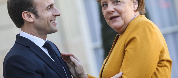 French President Emmanuel Macron (L) welcomes German Chancellor Angela Merkel as she arrives for a working meeting at the Elysee Palace on febuary 27, 2019, in Paris French President Emmanuel Macron (L) welcomes German Chancellor Angela Merkel as she arrives for a working meeting at the Elysee Palace on febuary 27, 2019, in Paris - Sputnik International