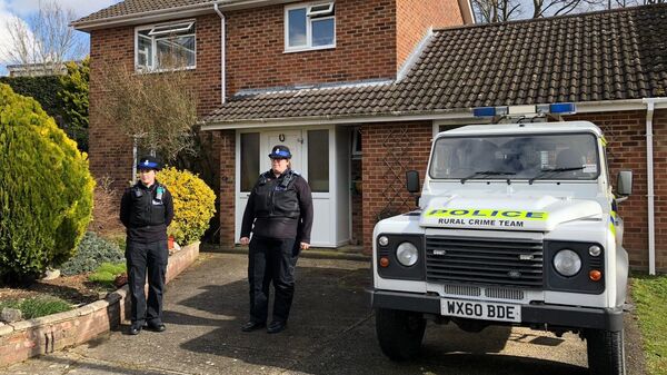 A police officer stands guard outside of the home of former Russian military intelligence officer Sergei Skripal, in Salisbury, Britain - Sputnik International