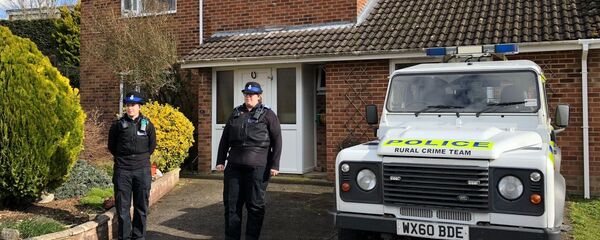 A police officer stands guard outside of the home of former Russian military intelligence officer Sergei Skripal, in Salisbury, Britain - Sputnik International