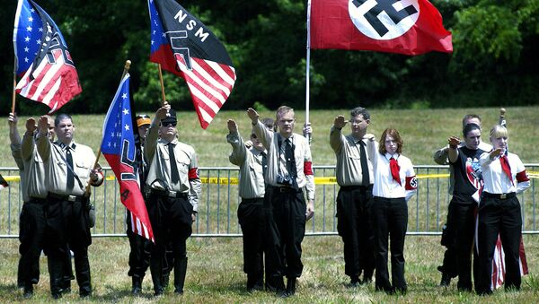 Members of the US National Socialist Movement (NSM) party and their supporters offer the Nazi salute during a rally in Virginia - Sputnik International