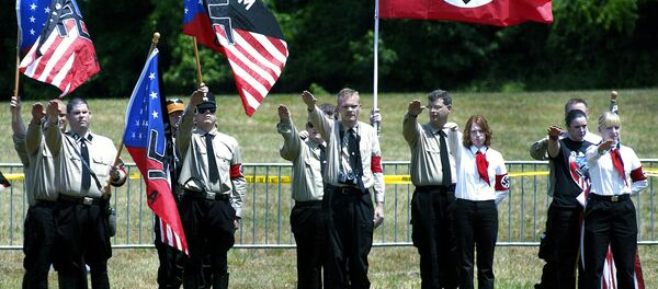 Members of the US National Socialist Movement (NSM) party and their supporters offer the Nazi salute during a rally in Virginia - Sputnik International