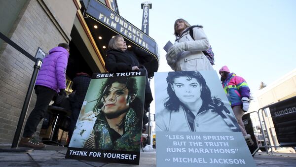 In this Jan. 25, 2019, file photo Brenda Jenkyns, left, and Catherine Van Tighem who drove from Calgary, Canada stand with signs outside of the premiere of the Leaving Neverland Michael Jackson documentary film at the Egyptian Theatre on Main Street during the 2019 Sundance Film Festival in Park City, Utah - Sputnik International