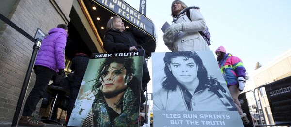 In this Jan. 25, 2019, file photo Brenda Jenkyns, left, and Catherine Van Tighem who drove from Calgary, Canada stand with signs outside of the premiere of the Leaving Neverland Michael Jackson documentary film at the Egyptian Theatre on Main Street during the 2019 Sundance Film Festival in Park City, Utah - Sputnik International