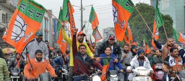 Indian Bharatiya Janata Party (BJP) workers hold BJP flags during a 'Vijay Sankalp' bike rally in Amritsar on March 2, 2019 Indian Bharatiya Janata Party (BJP) workers hold BJP flags during a 'Vijay Sankalp' bike rally in Amritsar on March 2, 2019 - Sputnik International