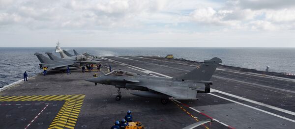 A French Rafale fighter taxis after landing on the deck of the Charles de Gaulle aircraft carrier on February 7, 2019 in the Mediterranean sea A French Rafale fighter taxis after landing on the deck of the Charles de Gaulle aircraft carrier on February 7, 2019 in the Mediterranean sea - Sputnik International
