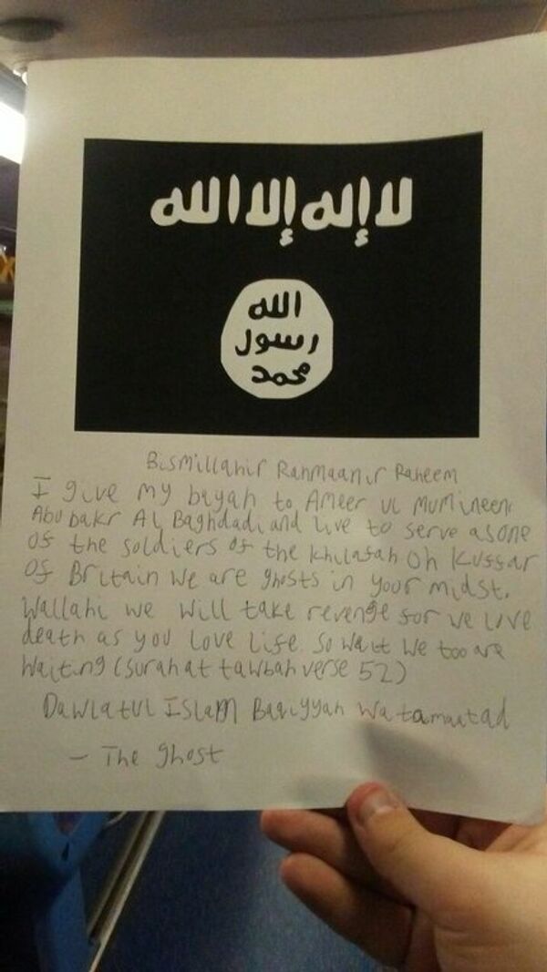 A letter, handwritten by Lewis Ludlow using the moniker The Ghost, and carrying a copy of the Daesh flag A letter, handwritten by Lewis Ludlow using the moniker The Ghost, and carrying a copy of the Daesh flag - Sputnik International