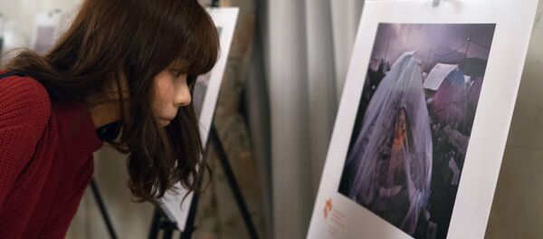 An exhibition of photos by winners of the Andrei Stenin International Press Photo Contest opened in Tokyo - Sputnik International
