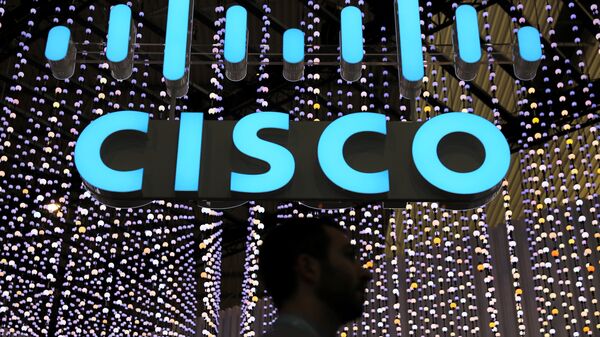 A man passes under a Cisco logo at the Mobile World Congress in Barcelona, Spain February 25, 2019 - Sputnik International
