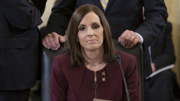 Before a hearing by the Senate Armed Services Subcommittee on Personnel about prevention and response to sexual assault in the military, Sen. Martha McSally, R-Ariz., prepares to recount her own experience while serving as a colonel in the Air Force, on Capitol Hill in Washington, Wednesday, March 6, 2019. McSally, the first female fighter pilot to fly in combat, says she was raped in the Air Force by superior officer - Sputnik International