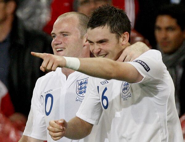 Adam Johnson (right) celebrates with Wayne Rooney after scoring for England against Switzerland in 2010 - Sputnik International
