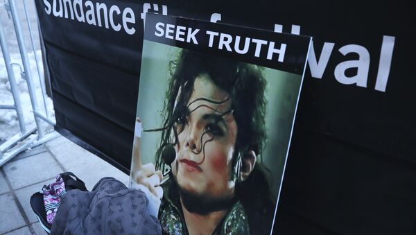 A sign in support of Michael Jackson is seen outside of the premiere of the Leaving Neverland Michael Jackson documentary film at the Egyptian Theatre on Main Street during the 2019 Sundance Film Festival, Friday, Jan. 25, 2019, in Park City, Utah - Sputnik International