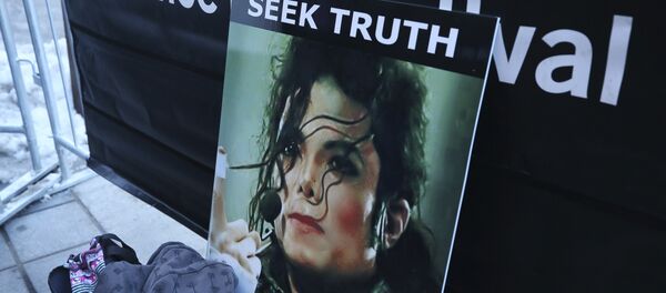 A sign in support of Michael Jackson is seen outside of the premiere of the Leaving Neverland Michael Jackson documentary film at the Egyptian Theatre on Main Street during the 2019 Sundance Film Festival, Friday, Jan. 25, 2019, in Park City, Utah A sign in support of Michael Jackson is seen outside of the premiere of the Leaving Neverland Michael Jackson documentary film at the Egyptian Theatre on Main Street during the 2019 Sundance Film Festival, Friday, Jan. 25, 2019, in Park City, Utah - Sputnik International