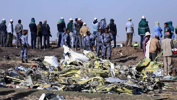 Ethiopian Federal policemen stand at the scene of the Ethiopian Airlines Flight ET 302 plane crash, near the town of Bishoftu, southeast of Addis Ababa, Ethiopia March 11, 2019 - Sputnik International