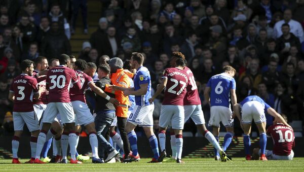 Aston Villa's Jack Grealish sits, nursing a sore head, after being punched by a Birmingham City fan at a game on 10 March 2019 - Sputnik International