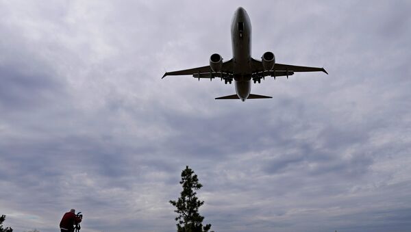 An American Airlines Boeing 737 MAX 8 flight from Los Angeles approaches for landing at Reagan National Airport shortly after an announcement was made by the FAA that the planes were being grounded by the United States in Washington, U.S. March 13, 2019 - Sputnik International