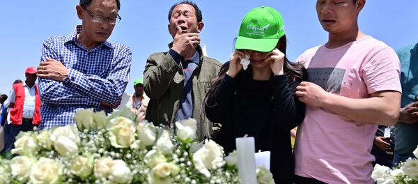 Family members mourn the victims at the crash site of the Ethiopian Airlines operated Boeing 737 MAX aircraft, at Hama Quntushele village in the Oromia region, on March 13, 2019 Family members mourn the victims at the crash site of the Ethiopian Airlines operated Boeing 737 MAX aircraft, at Hama Quntushele village in the Oromia region, on March 13, 2019 - Sputnik International