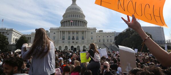 High school students demonstrate outside the U.S. Capitol building over gun violence and school shootings in Washington High school students demonstrate outside the U.S. Capitol building over gun violence and school shootings in Washington - Sputnik International