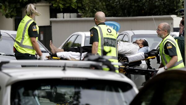 Ambulance staff take a man from outside a mosque in central Christchurch, New Zealand, Friday, - Sputnik International