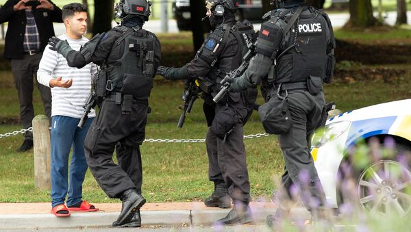 AOS (Armed Offenders Squad) push back members of the public following a shooting at the Masjid Al Noor mosque in Christchurch - Sputnik International