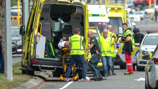 An injured person is loaded into an ambulance following a shooting at the Al Noor mosque in Christchurch - Sputnik International