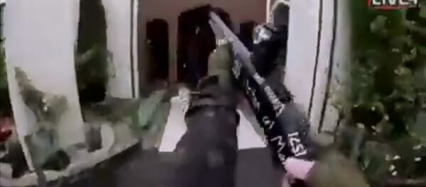 A still image taken from video circulated on social media, apparently taken by a gunman and posted online live as the attack unfolded, shows him entering a mosque in Christchurch, New Zealand, March 15, 2019 - Sputnik International