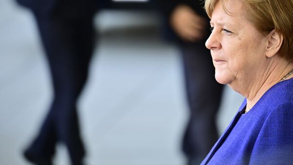 German Chancellor Angela Merkel waits for her guest, the Laotian Prime Minister, before a welcome ceremony and talks at the chancellery in Berlin on March 13, 2019 - Sputnik International