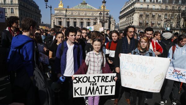 Swedish teenager Greta Thunberg, center, leads a march of thousands of French students through Paris, France, Friday, Feb. 22, 2019, to draw more attention to fighting climate change - Sputnik International