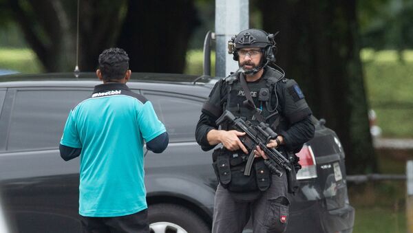 AOS (Armed Offenders Squad) push back members of the public following a shooting at the Al Noor mosque in Christchurch, New Zealand, March 15, 2019. - Sputnik International