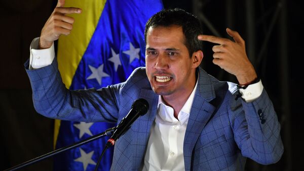 Venezuelan opposition leader and self-proclaimed interim president Juan Guaido delivers a speech during a meeting with local leaders in Caracas, on March 14, 2019. Venezuelans resumed work Thursday after a weeklong hiatus forced by an unprecedented nationwide blackout - Sputnik International
