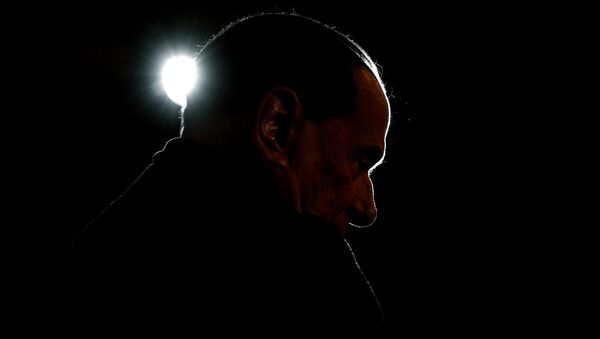 Leader of the Italian right-wing party Forza Italia (Go Italy) Silvio Berlusconi looks on during a campaign rally in Milan on February 25, 2018 - Sputnik International