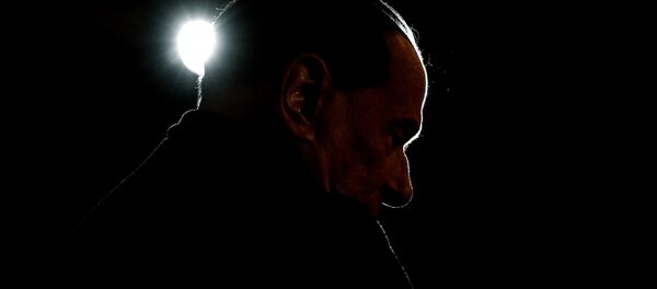 Leader of the Italian right-wing party Forza Italia (Go Italy) Silvio Berlusconi looks on during a campaign rally in Milan on February 25, 2018 - Sputnik International