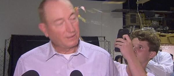 In this image made from video, a teenager breaks an egg on the head of Senator Fraser Anning while he holds a press conference, Saturday, March 16, 2019, in Melbourne - Sputnik International