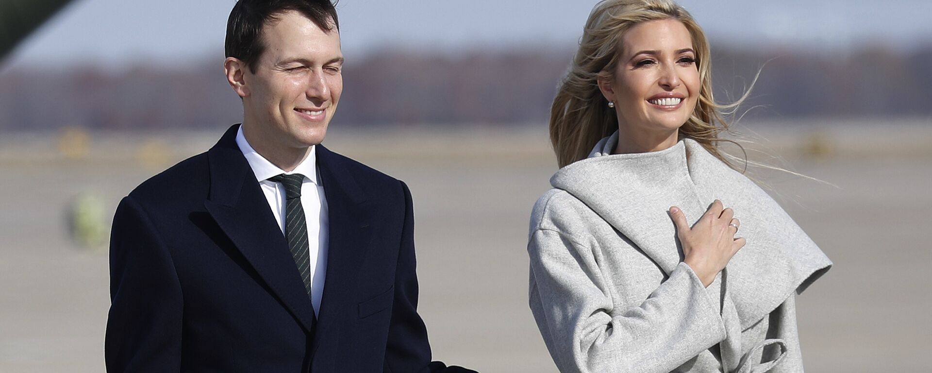 White House Senior Adviser Jared Kushner, left and Ivanka Trump, the daughter and assistant to President Donald Trump walk across the tarmac before boarding Air Force One, Thursday, Nov. 29, 2018 at Andrews Air Force Base, Md. - Sputnik International, 1920, 11.10.2021