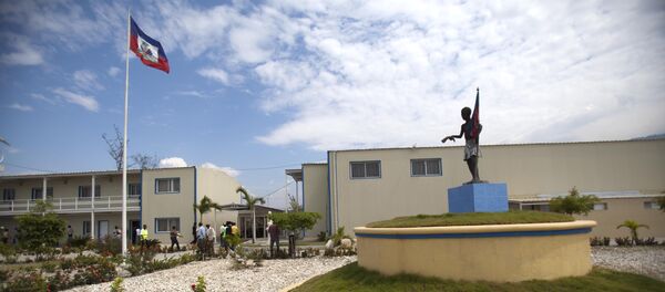 In this March 15, 2013 photo, Haiti's national flag flies outside parliament which was renovated by Chemonics International Inc., a for-profit international development company based in Washington D.C., in downtown of Port-au-Prince, Haiti. - Sputnik International